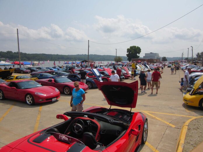 Corvettes line the LeClaire parking lot by the Mississippi River for the popular Vettes on the River car show.